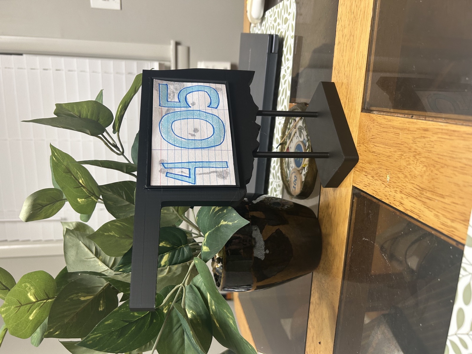 Close-up of the table number centerpiece frame holding a numbered card